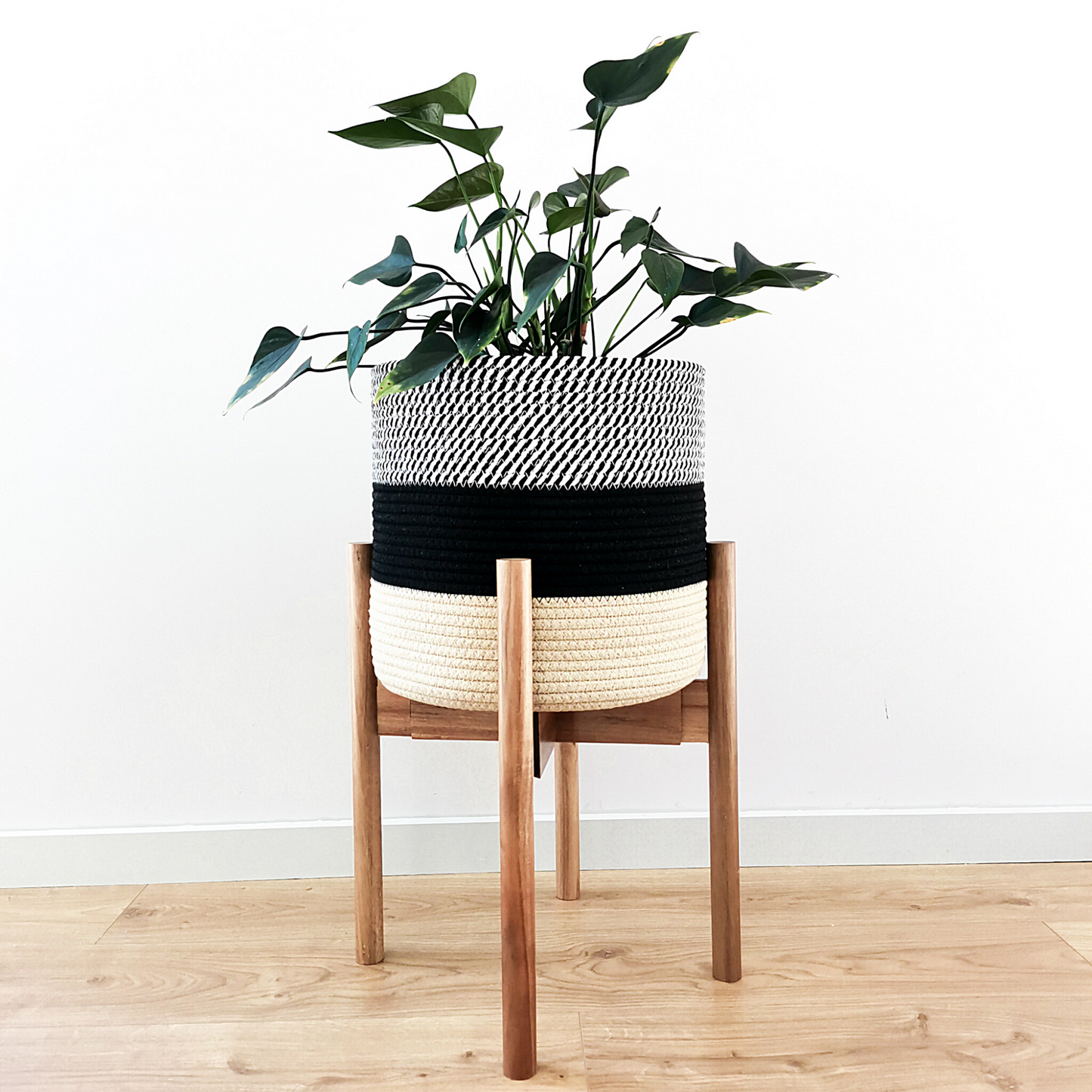 Elevate your plants and decor with the sleek design of our minimalist plant stand. This sturdy, yet lightweight modern plant stand is handcrafted from acacia and bamboo wood that complements contemporary, farmhouse, rustic, mid-century modern interirors. 