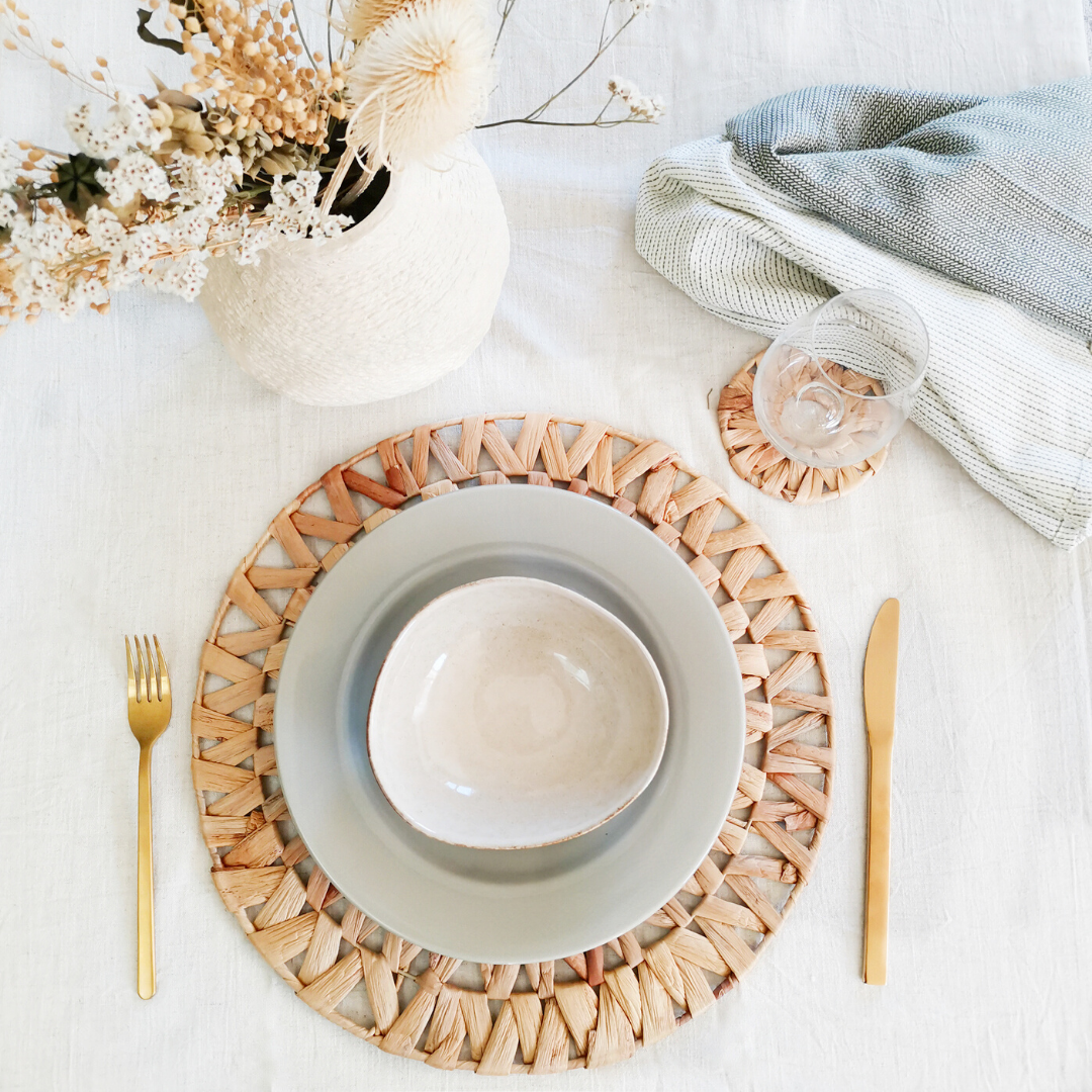 Boho woven rattan placemats for casual tablescapes with floral centerpiece