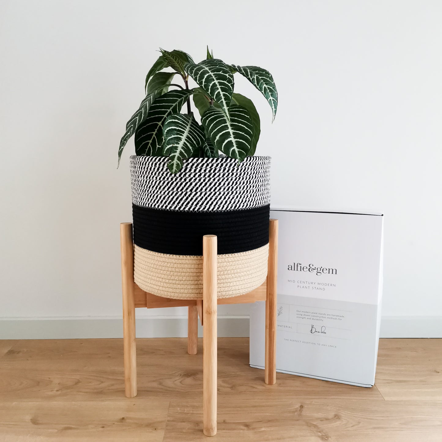 Mid-century plant stand and plant holder made from eco-friendly materials.