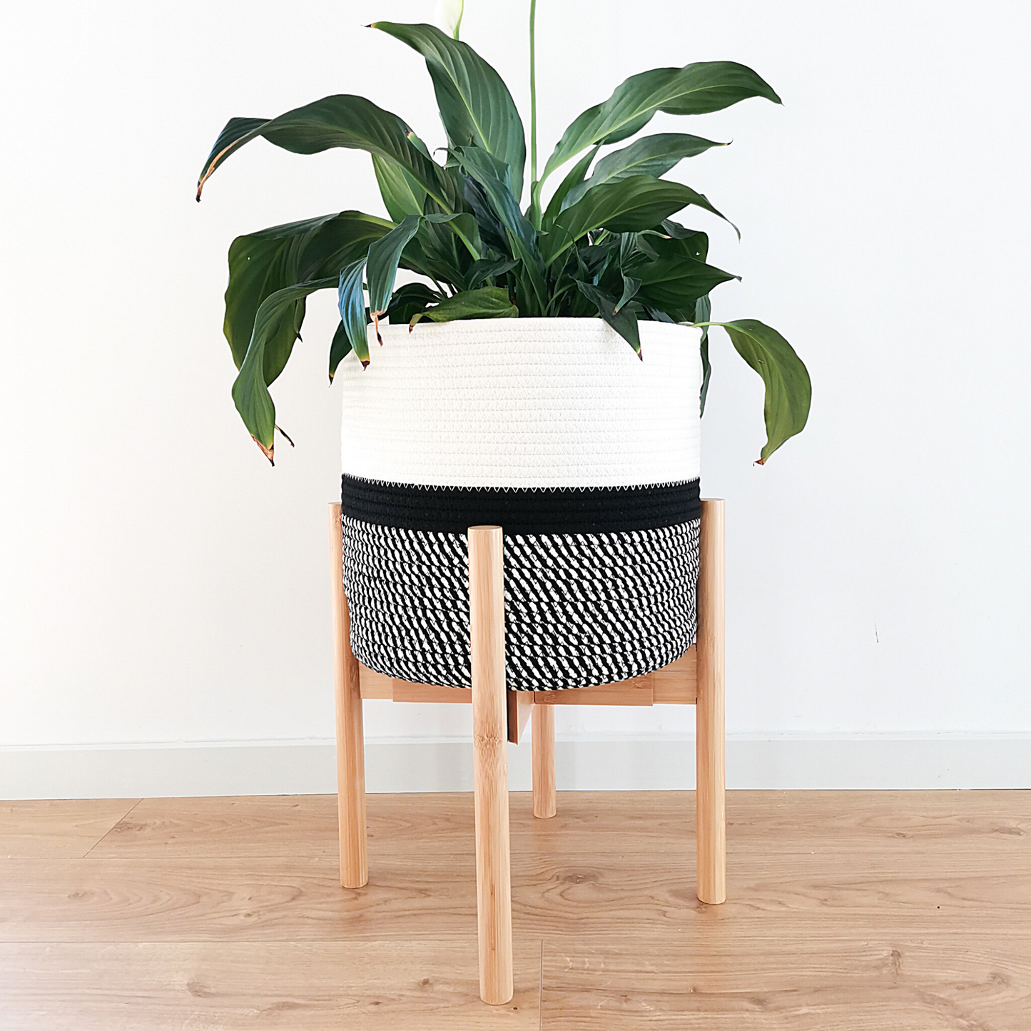 Plant stand and basket made from natural bamboo wood and cotton rope. Perfect for mid-century modern interior.