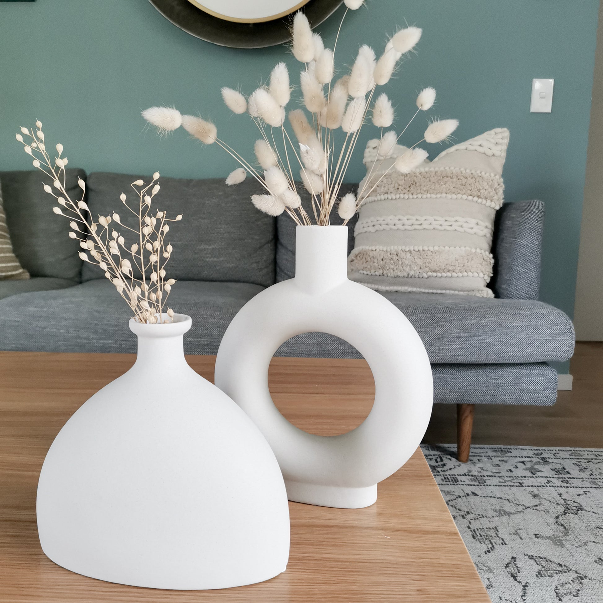White minimalist vase with pampas grass on a living room coffee table