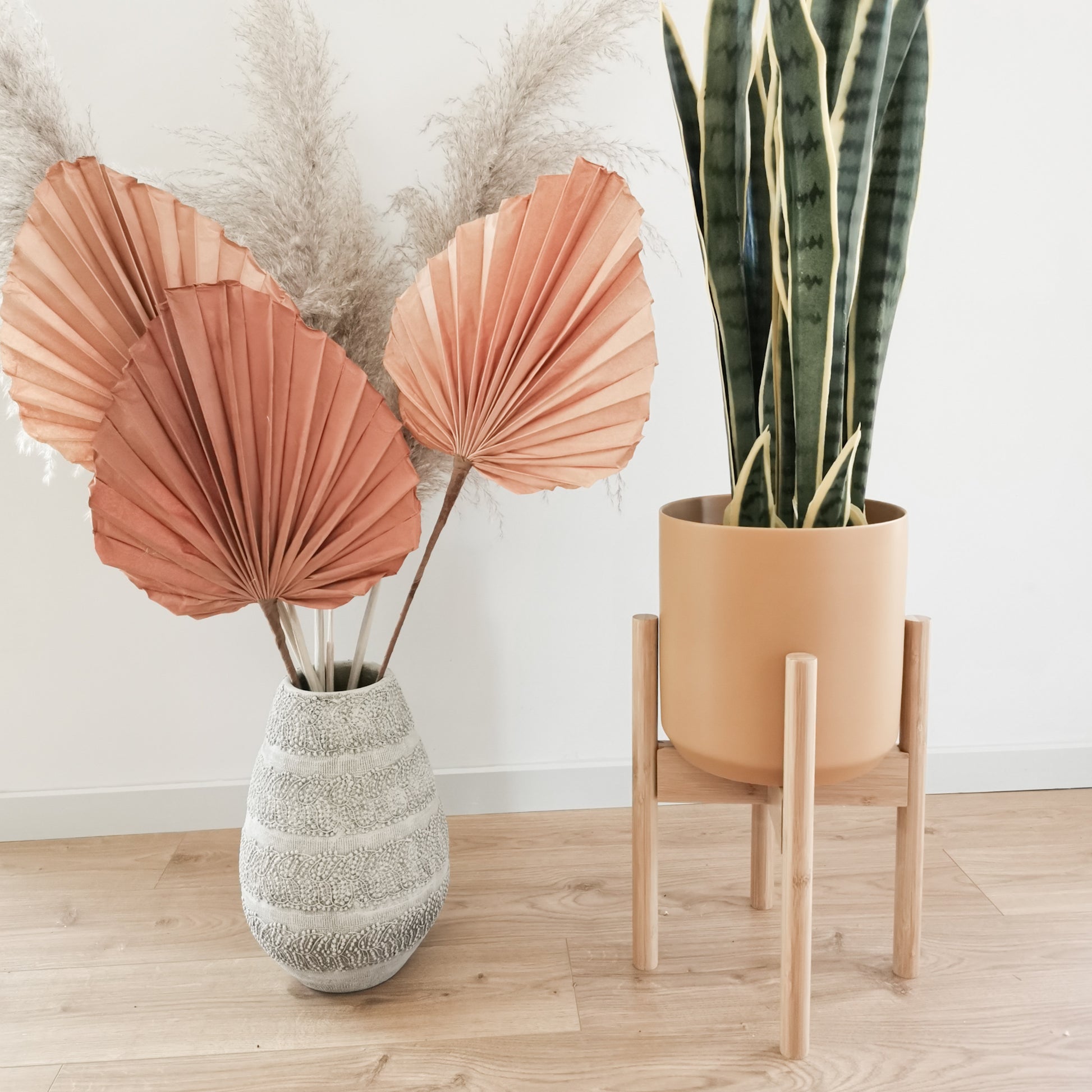 Bamboo indoor plant stand inspired by mid-century modern design. Perfect for different pot sizes and plants.