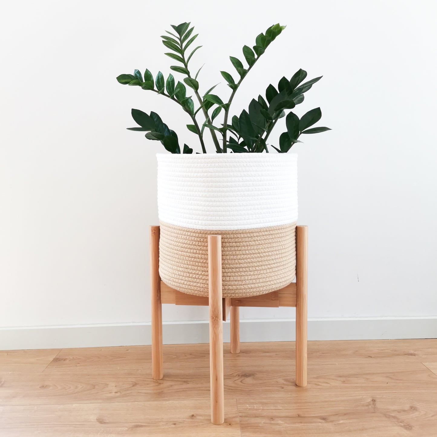 Minimalist wood plant stand with a classic mid-century modern style. These tall planter stands can be turned upside down to make your plants more eye-catching. They can also be adjusted to fit different pot sizes.