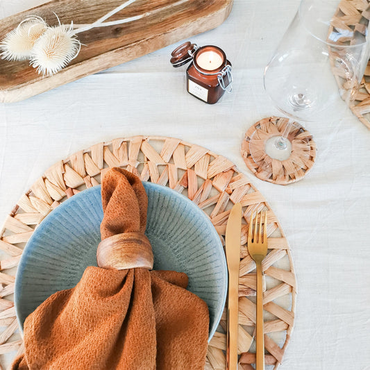 Simple boho table setting with woven placemat and coaster set