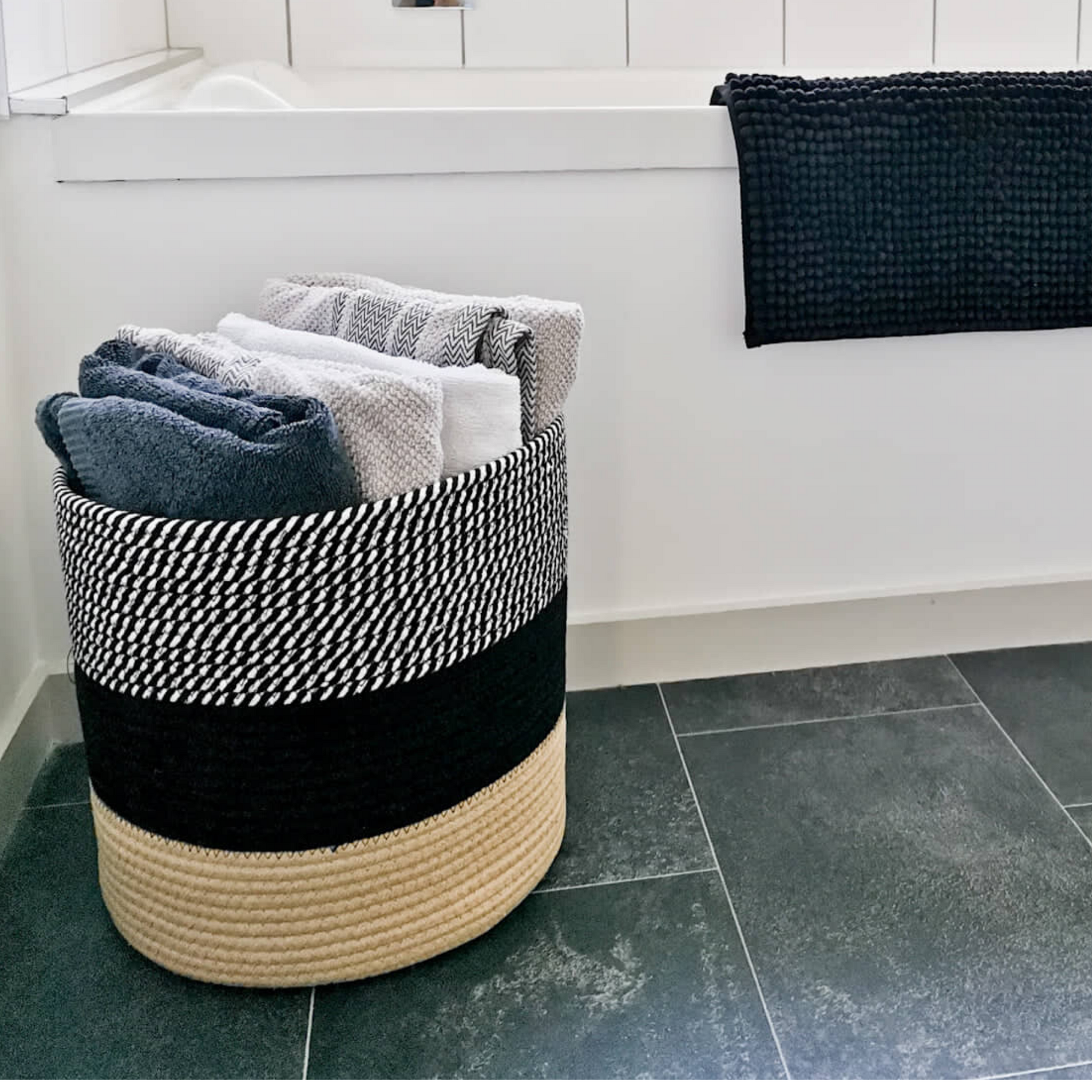 Black and white cotton rope basket for storing laundry, towels, pillows, rugs. Decorative and multi-functional jute basket.