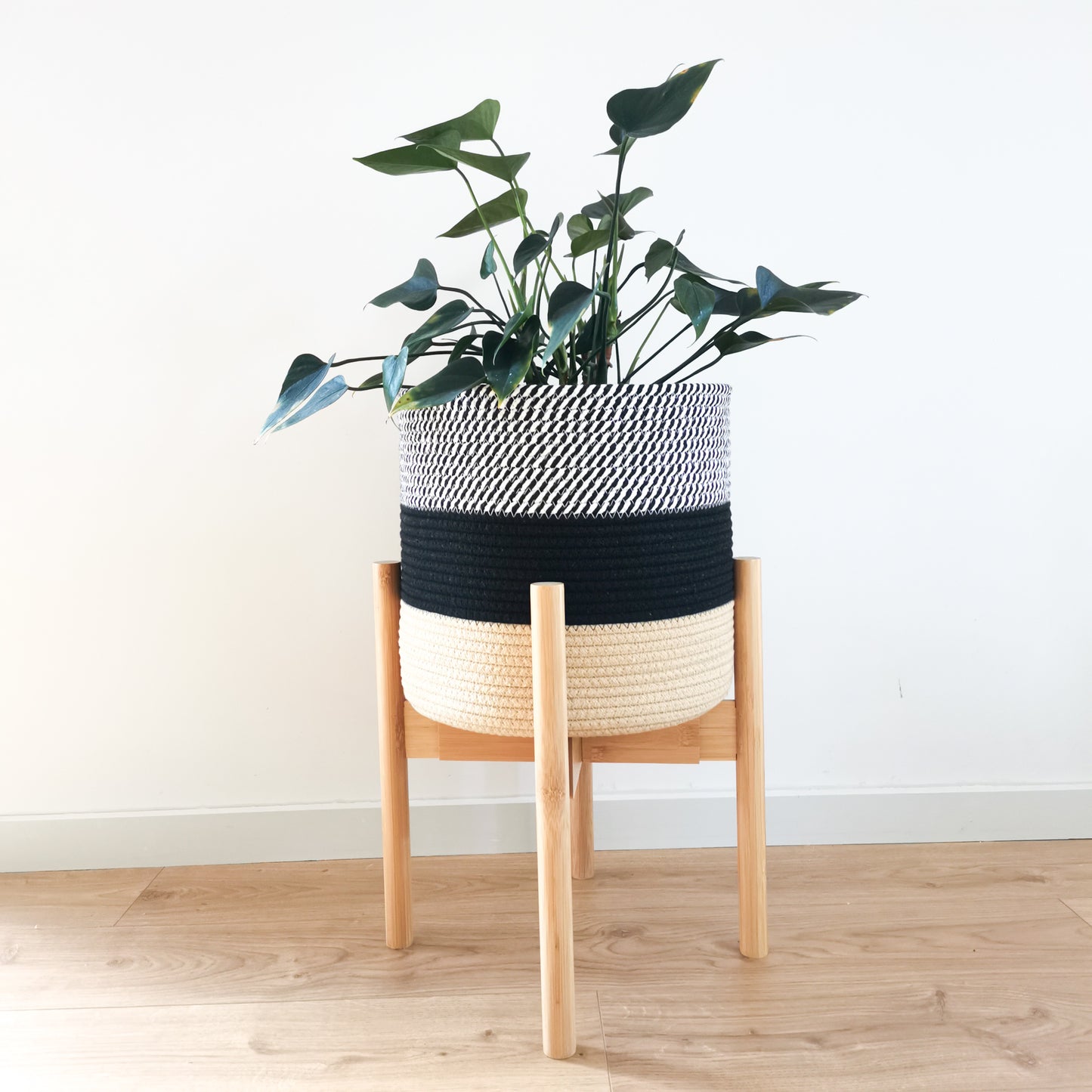 Our cotton basket is a beautiful way to complete any room. Made from 100% pure cotton rope, this eco-friendly basket features neutral tones like black, white, and beige. In addition, the woven pattern gives your space a unique natural texture.